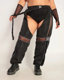 Evolution Chaps With Silver Reflective Stripes & Fishnet Panels -I Hear Raves Evolution Chaps with Silver Reflective Stripes Fishnet Panels C1 BlkSlvr Front