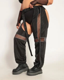 Evolution Chaps With Silver Reflective Stripes & Fishnet Panels -I Hear Raves Evolution Chaps with Silver Reflective Stripes Fishnet Panels C1 BlkSlvr Side